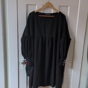 Elegant Black Dress with Button Detail